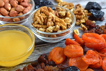 Dried fruits and honey on wooden background.Healthy.