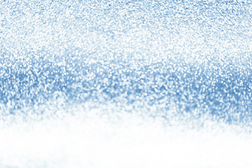 Abstract silver shiny sparkling glittering background. Blue color luxury design bokeh. Snowy  texture.