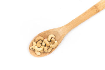Cashew nuts in a spoon. Top view