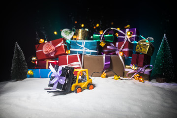 Store promotions. Craft christmas gifts in shopping cart over wooden background, copy space