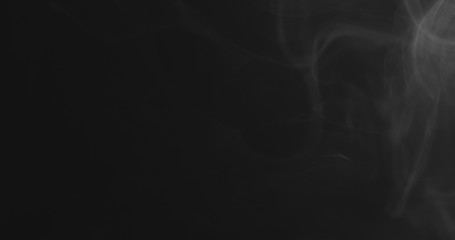 closeup vapor floating in air on black background