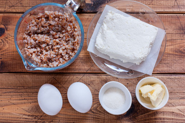 Step-by-step cooking of buckwheat krupenik with cottage cheese, step 1 - preparation of ingredients, selective focus, top view