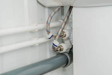 The photo of the established plastic pipes for water supply
