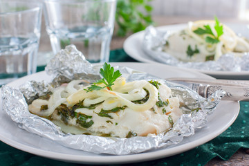 Cod baked in foil with parsley and onion, horizontal