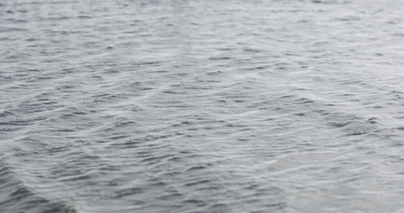 waves on a beach on a windy sunny day