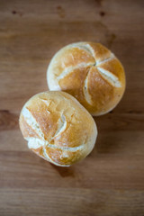 Two white round crusty rolls