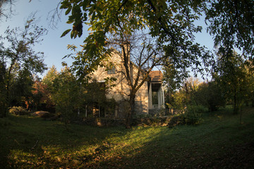Fototapeta premium Beautiful landscape village house with trees at the forest during autumn, Azerbaijan