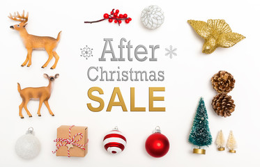 After Christmas sale message with small Christmas ornaments on a white background