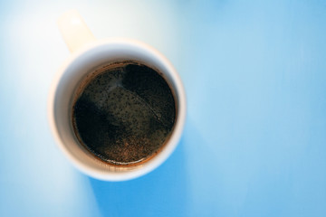 coffee grounds on the bottom of the cup