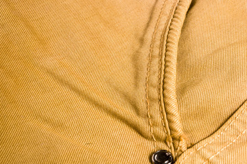clothing items washed cotton fabric texture with seams, clasps, buttons and rivets