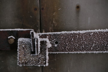 frozen lock on door. frozen padlock. so cold and metal freeze