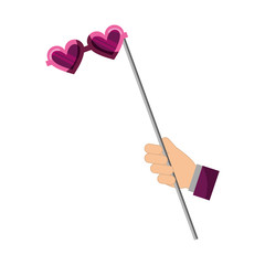 hand with glasses with heart shaped lens in stick