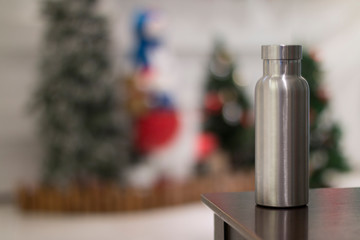 Insulated Stainless Bottle with christmas tree decoration background