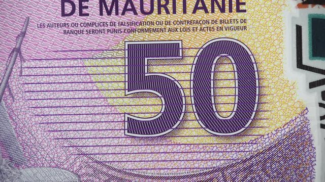 Mauritanian 50 ouguiya (2017) banknote rotating, Mauritania money close up. 4K UHD video footage.