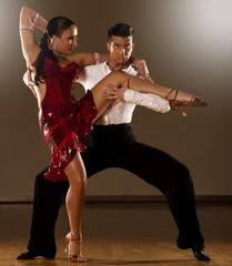 latino dance couple in action - dancing wild samba