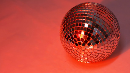 beautiful disco ball on yellow background isolated.