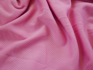 pink sportswear cloth texture background,silk fabric texture,pink background