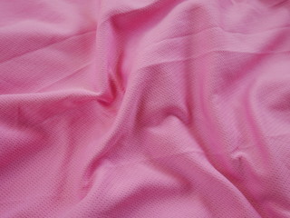 pink silk cloth,texture of cotton clothing,pink background