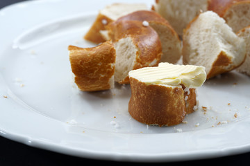 Fresh pretzel with sausage and cheese is a tasty snack