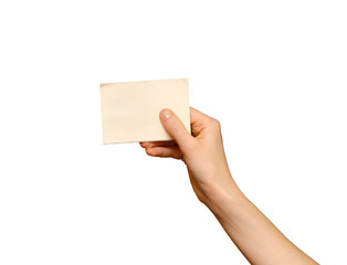 Fototapeta premium Female hand holding blank piece of card, isolated on white