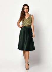 Naklejka premium Young beautiful woman posing in new black fashion winter dress full body on a white 