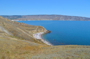 Fototapeta na wymiar Wild beach. Mountains and sea. Crimea