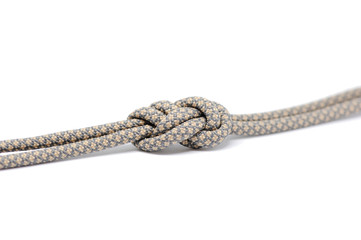 Knot on a cord on a white background .