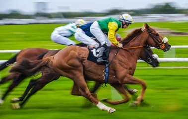 Crédence de cuisine en verre imprimé Léquitation Close-up of jockey and race horse in action, speeding fast motion blur