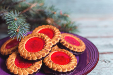 Christmas cookies. Cookies with raspberry jam on turicouse table