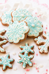 Christmas dekoration with cookies in the shape of snowflakes and stars on a white background. Top view.