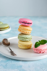 Colorful macarons cakes. Small French cakes. Sweet and colorful french macaroons.