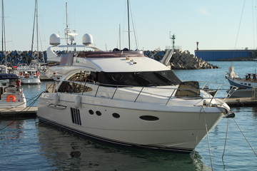 Fototapeta premium Sea yacht are at the pier in the port.