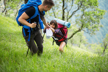 Fototapeta premium Couple with backpack enjoying at hiking trip