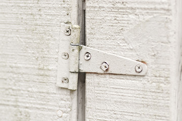 Old white door hinge