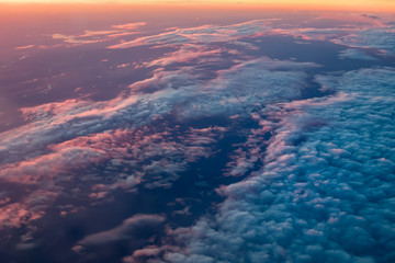 Beautiful sunset sky above clouds with dramatic light