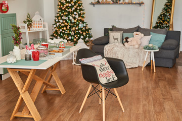 Bright christmas decoration of living kitchen, stylish interior loft. Happy New Year! Christmas greeting card. Winter card template. Xmas concept. Holiday Banner. Feast of Nativity.