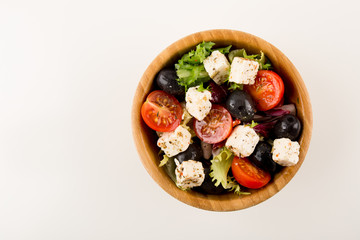Gourmet Salad, in wooden bowl isolated on white background, copy space
