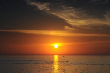 Travel to Slovenia.Travel to Slovenia. Red-orange stunningly beautiful sunset on the Adriatic Sea coast in Slovenia