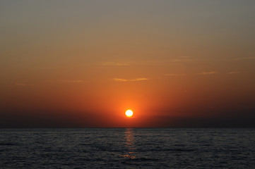 Travel to Slovenia.Travel to Slovenia. Red-orange stunningly beautiful sunset on the Adriatic Sea coast in Slovenia