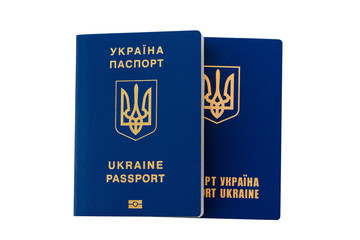 Two passports of citizens of Ukraine to travel abroad. Passport on a white background isolate. Passports for travel Ukrainian tourists.
