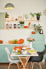 autumn kitchen decoration with pumpkins