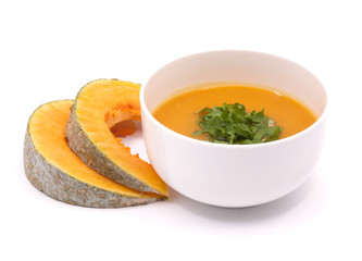 Pumpkin slices and soup isolated on white background.