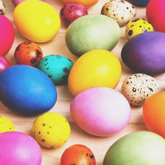Fototapeta na wymiar colorful easter eggs on a wooden background