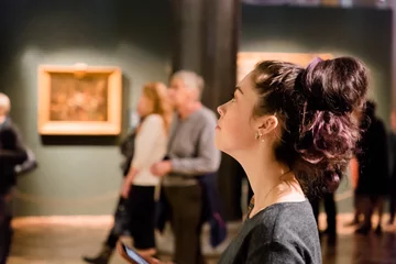 Fotobehang Young women waching arts at the museum. Excursion with group © _KUBE_