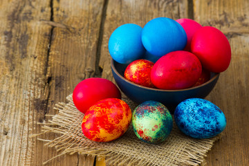 Fototapeta na wymiar Happy Easter, colorful eggs in a bowl