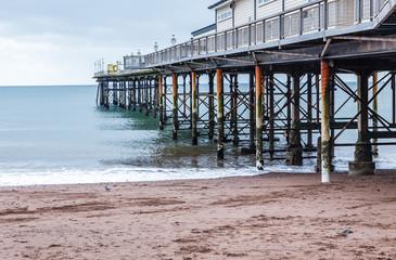 viewing platform at sea on long piles; calm sea, no waves, below the horizon