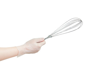 Metal whisk for whipping in hand. Kitchenware. White isolate