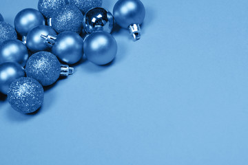 Christmas baubles on blue background.