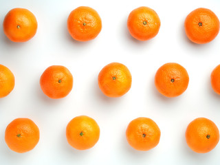ripe tangerines on a white background