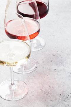 Fototapeta Red, rose and white wine glasses